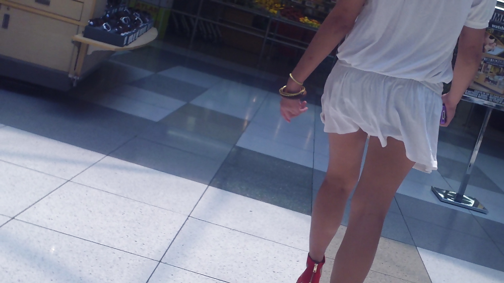 Cute girls ass & butt in short white mini skirt & red shoes #12647580