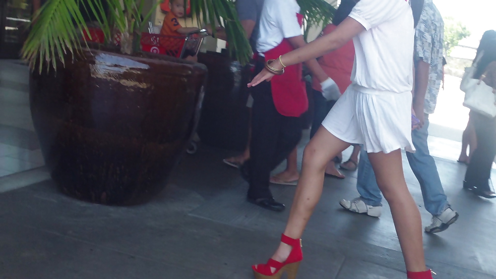 Cute girls ass & butt in short white mini skirt & red shoes #12647588