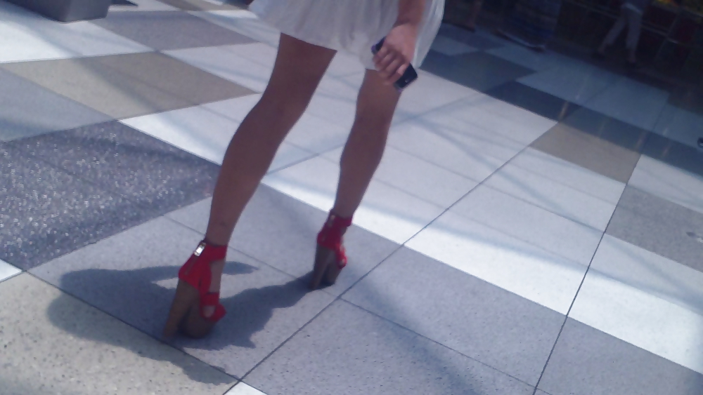 Cute girls ass & butt in short white mini skirt & red shoes #12647669