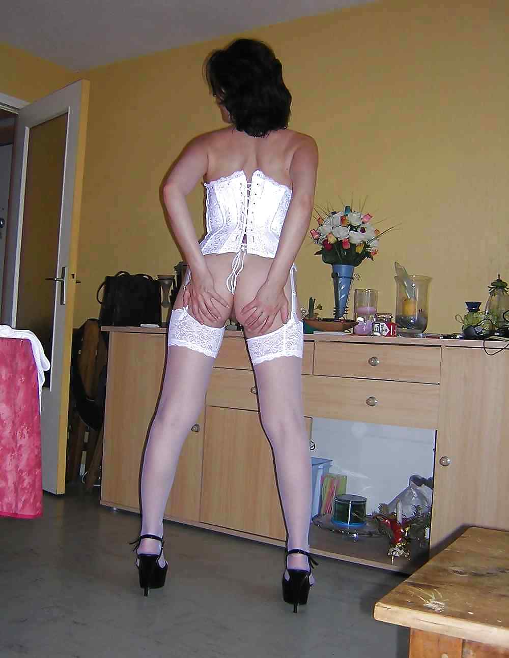 Amateur MILF Posing In Stockings And High Heels by DarKKo #22009447