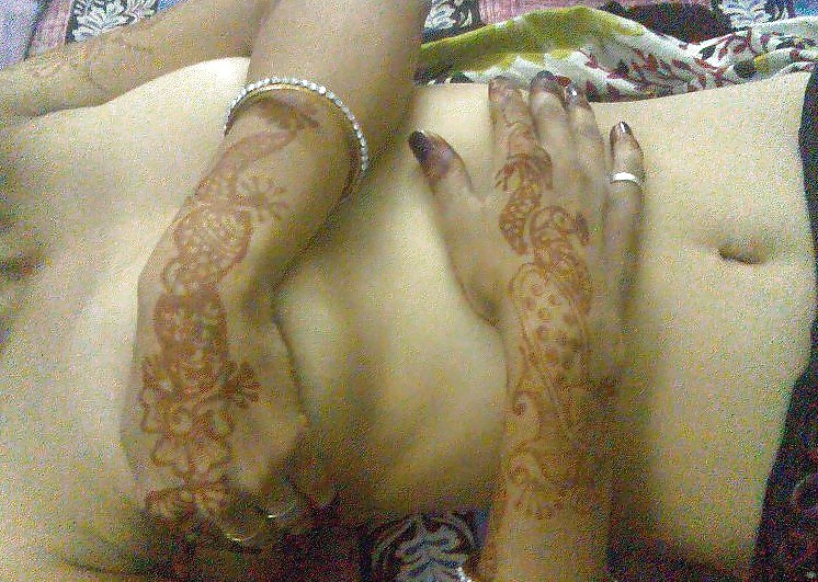 Indian newly wife with mehndi on hands #10805436