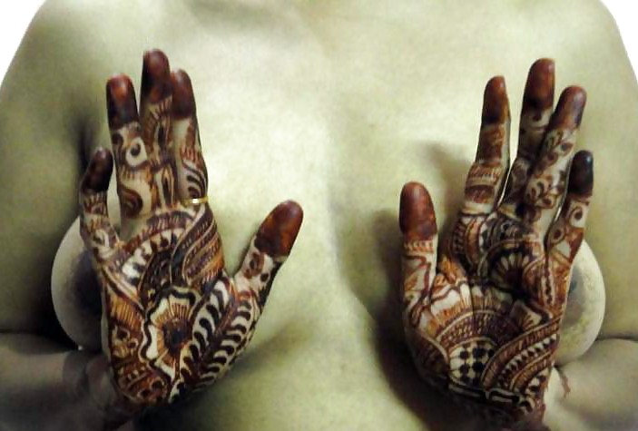 Indian newly wife with mehndi on hands #10805441