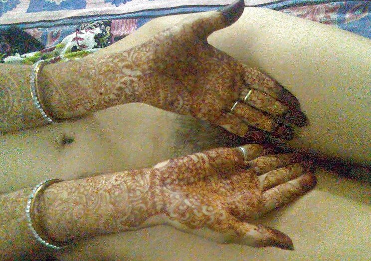 Indian newly wife with mehndi on hands #10805458