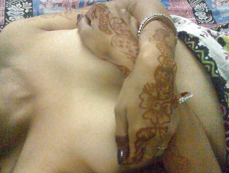 Indian newly wife with mehndi on hands #10805466