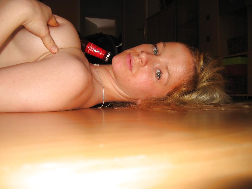 Blonde playing with a bottle - N. C.  #2691493