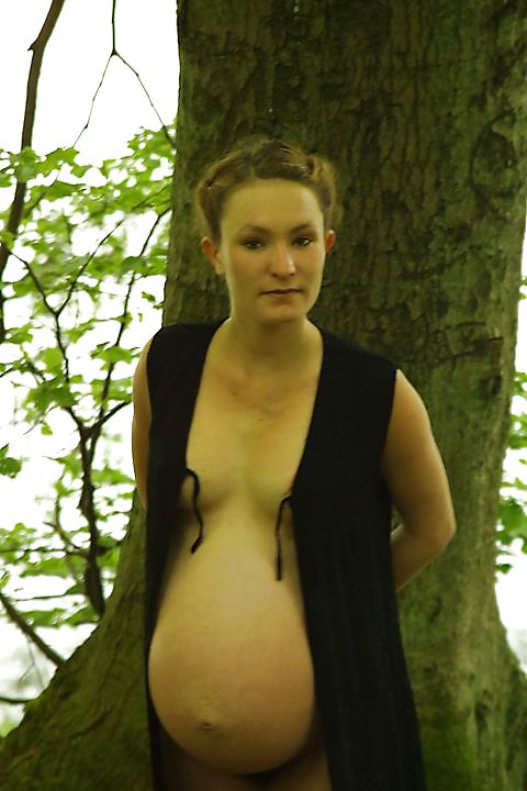 Cute pregger taking a walk in the forest #18724484