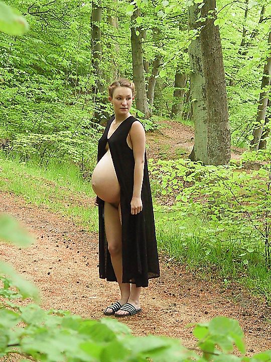 Cute pregger taking a walk in the forest #18724682