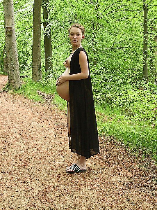 Cute pregger taking a walk in the forest #18724717