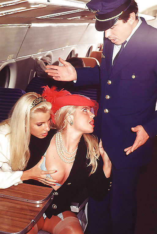 Two blondes servicing the captain on an airplane #16632893