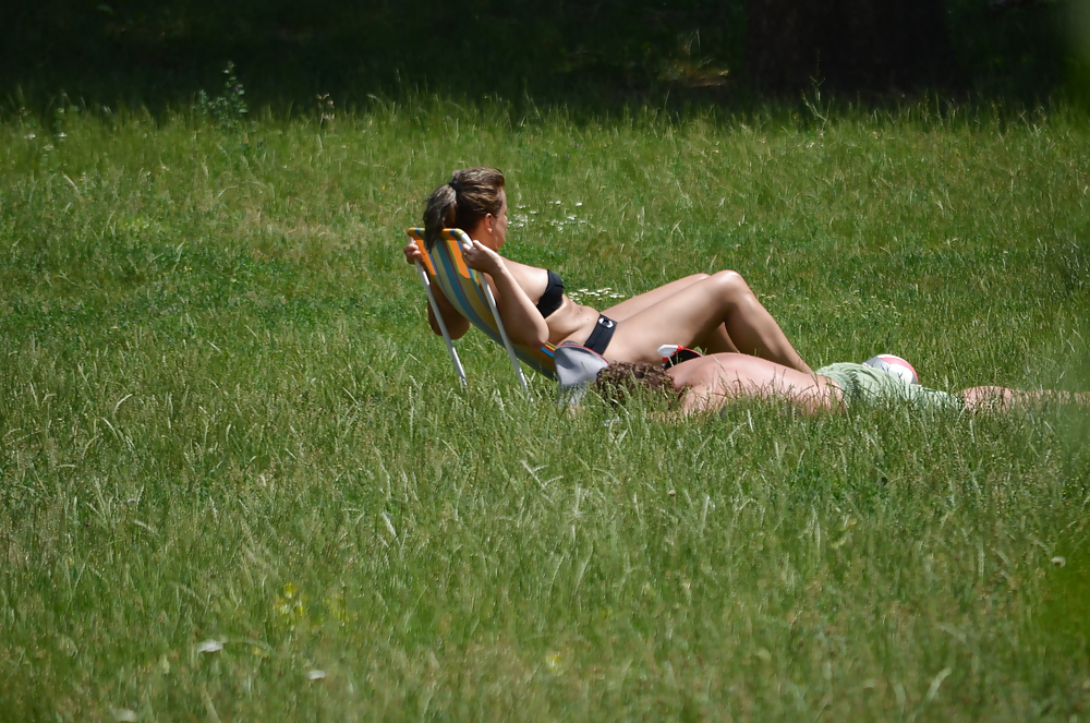 Girl sunbathing in the park I #11339362