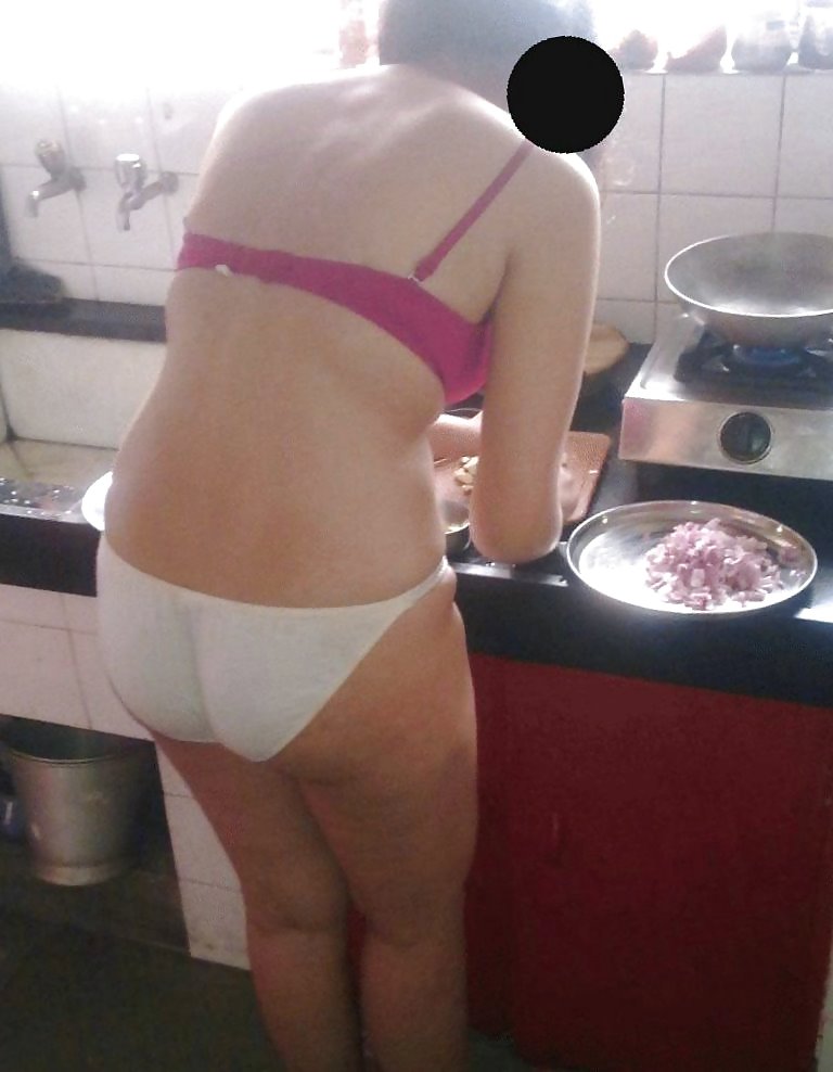 Indian wife working in kitchen - coolbudy #6939655
