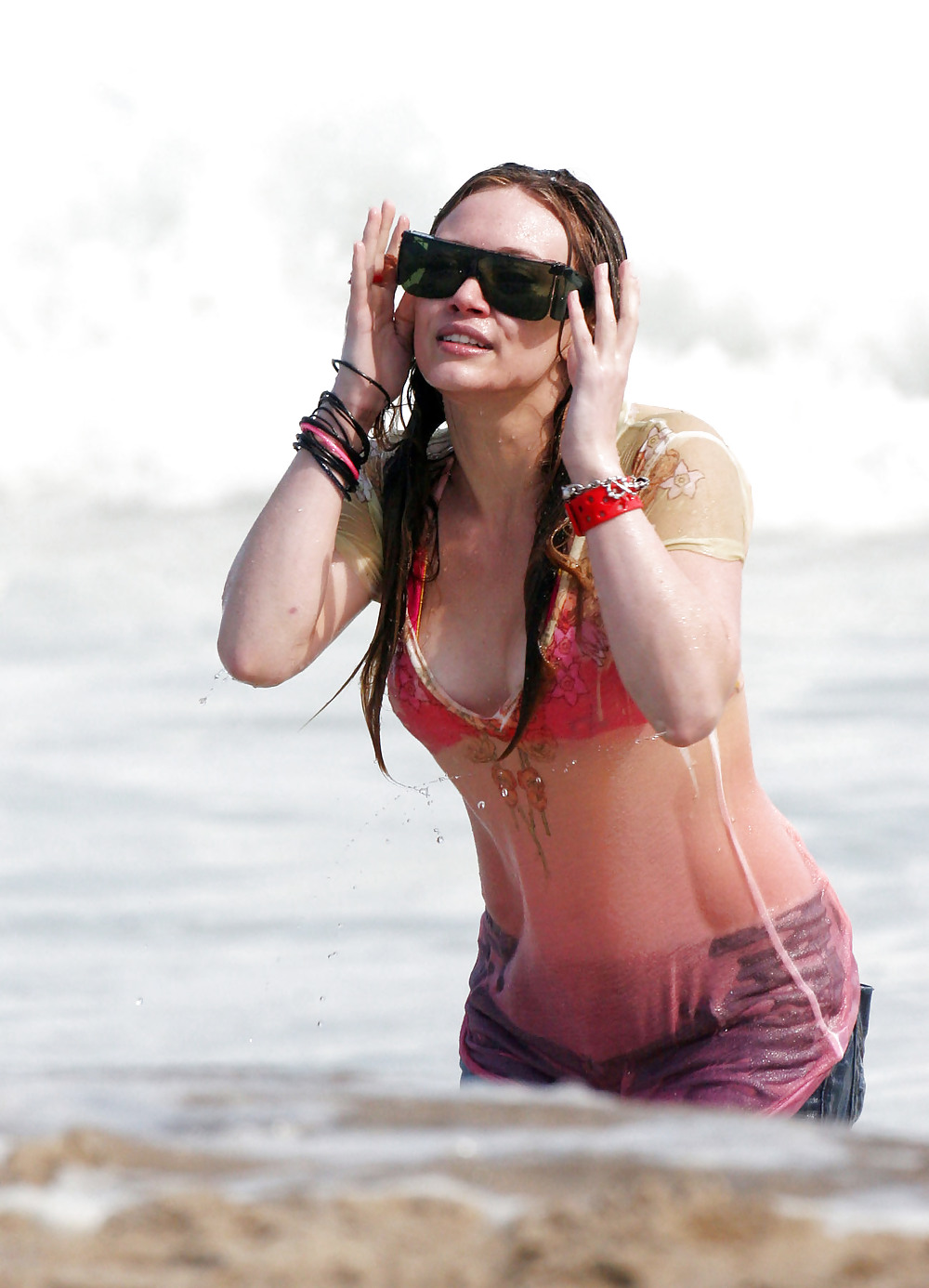 Hilary Duff at the Beach playing around in a wet shirt #7220823