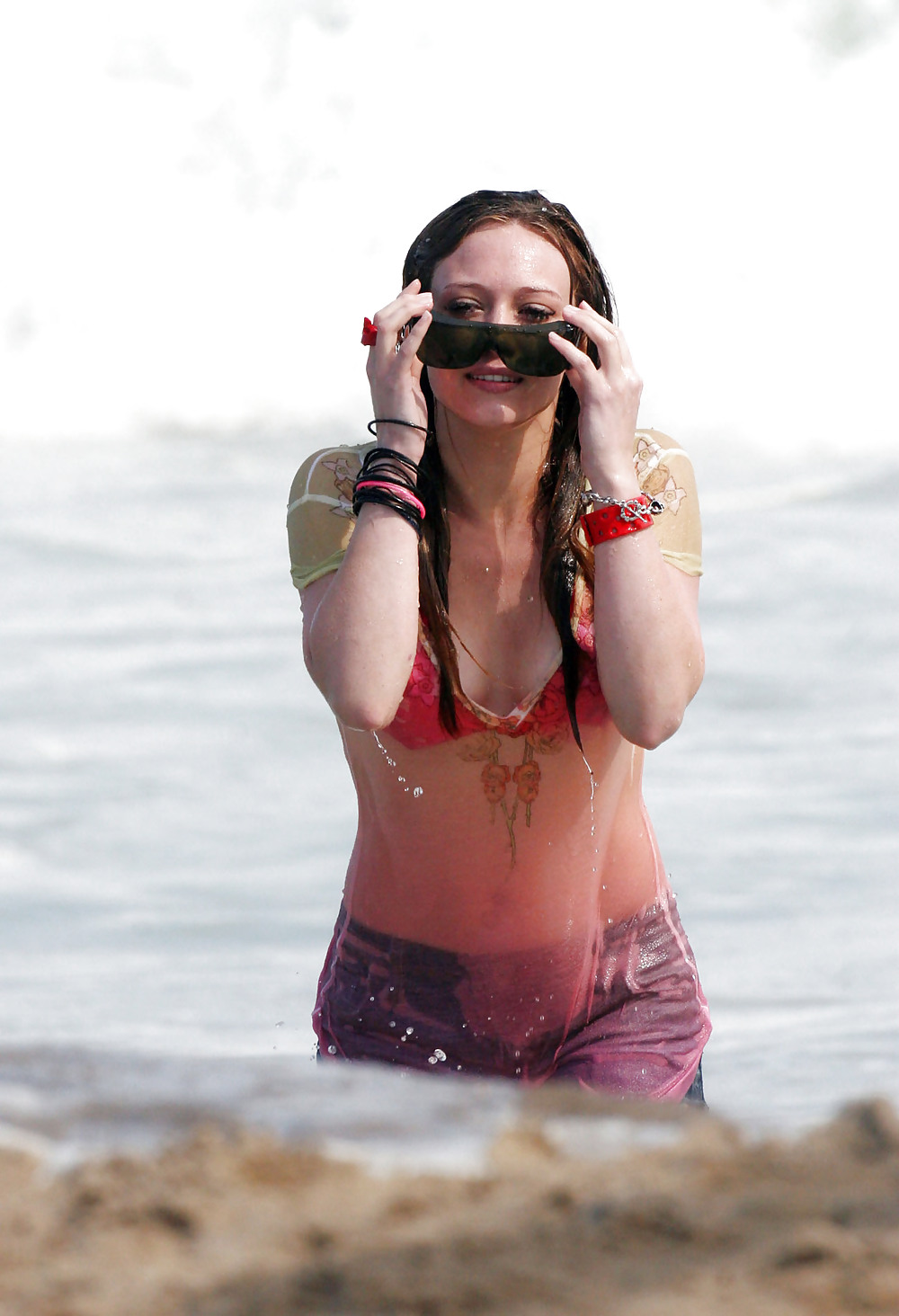 Hilary Duff at the Beach playing around in a wet shirt #7220887