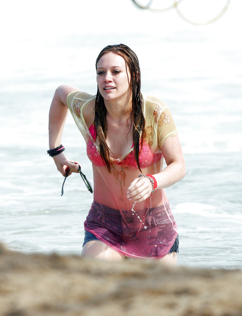 Hilary Duff at the Beach playing around in a wet shirt #7220924