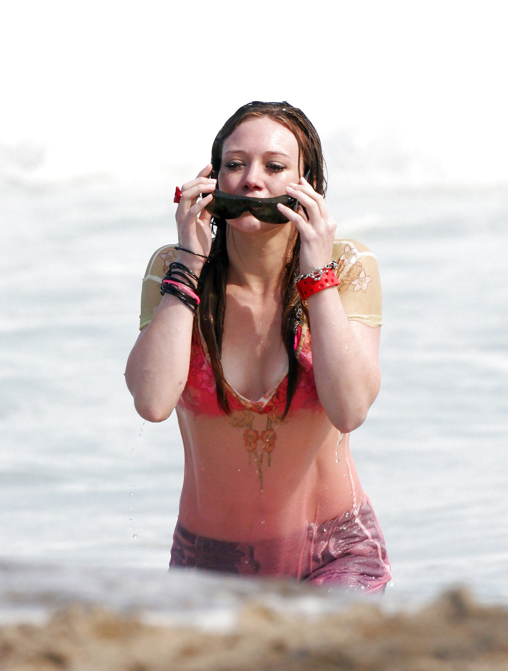 Hilary Duff at the Beach playing around in a wet shirt #7220971