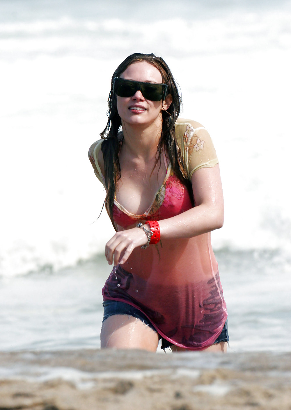 Hilary Duff at the Beach playing around in a wet shirt #7220981