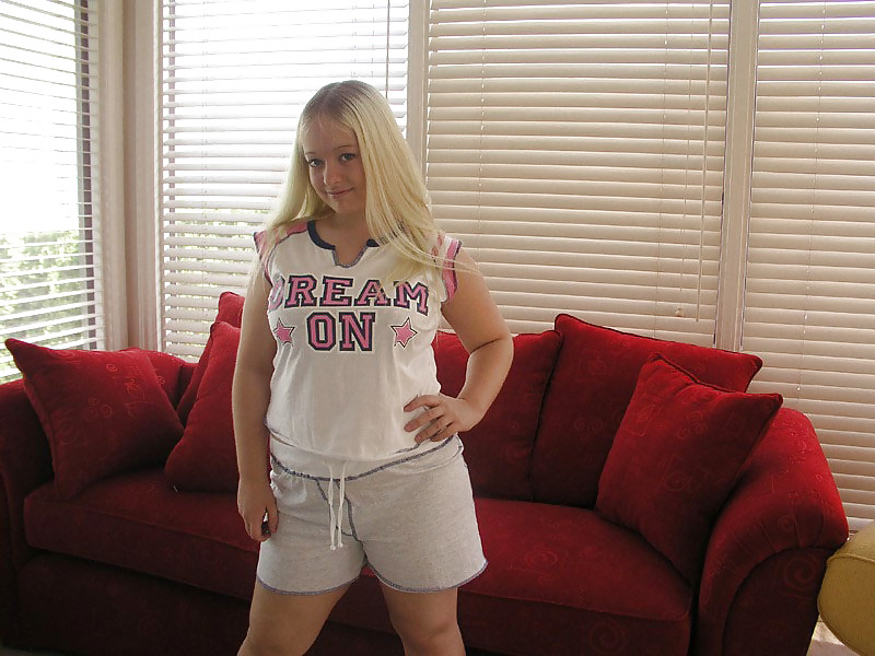 Chubby blonde posing on a red sofa #19768606