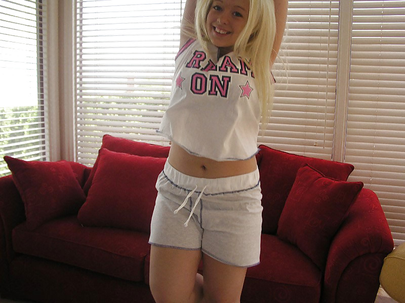 Chubby blonde posing on a red sofa #19768613