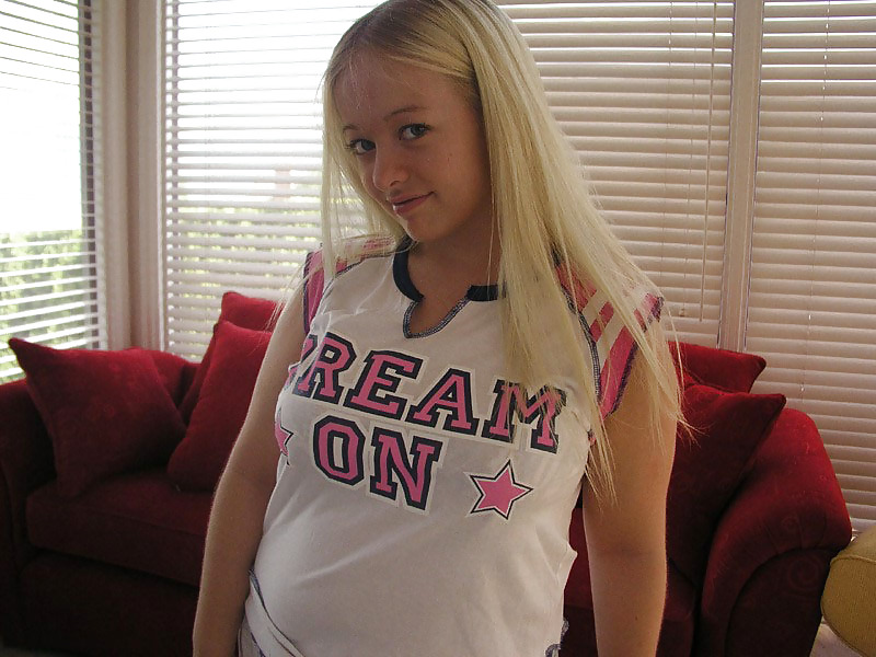 Chubby blonde posing on a red sofa #19768621