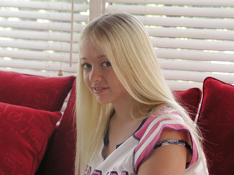 Chubby blonde posing on a red sofa #19768635