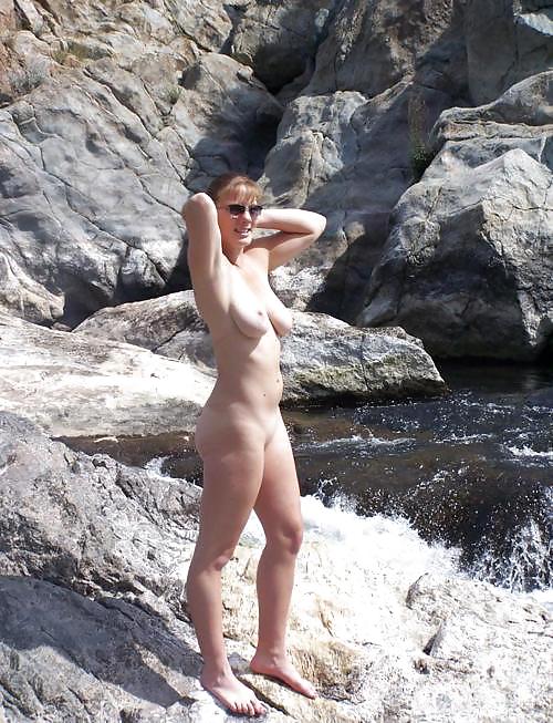 Nudist woman by the waterfall #14431365