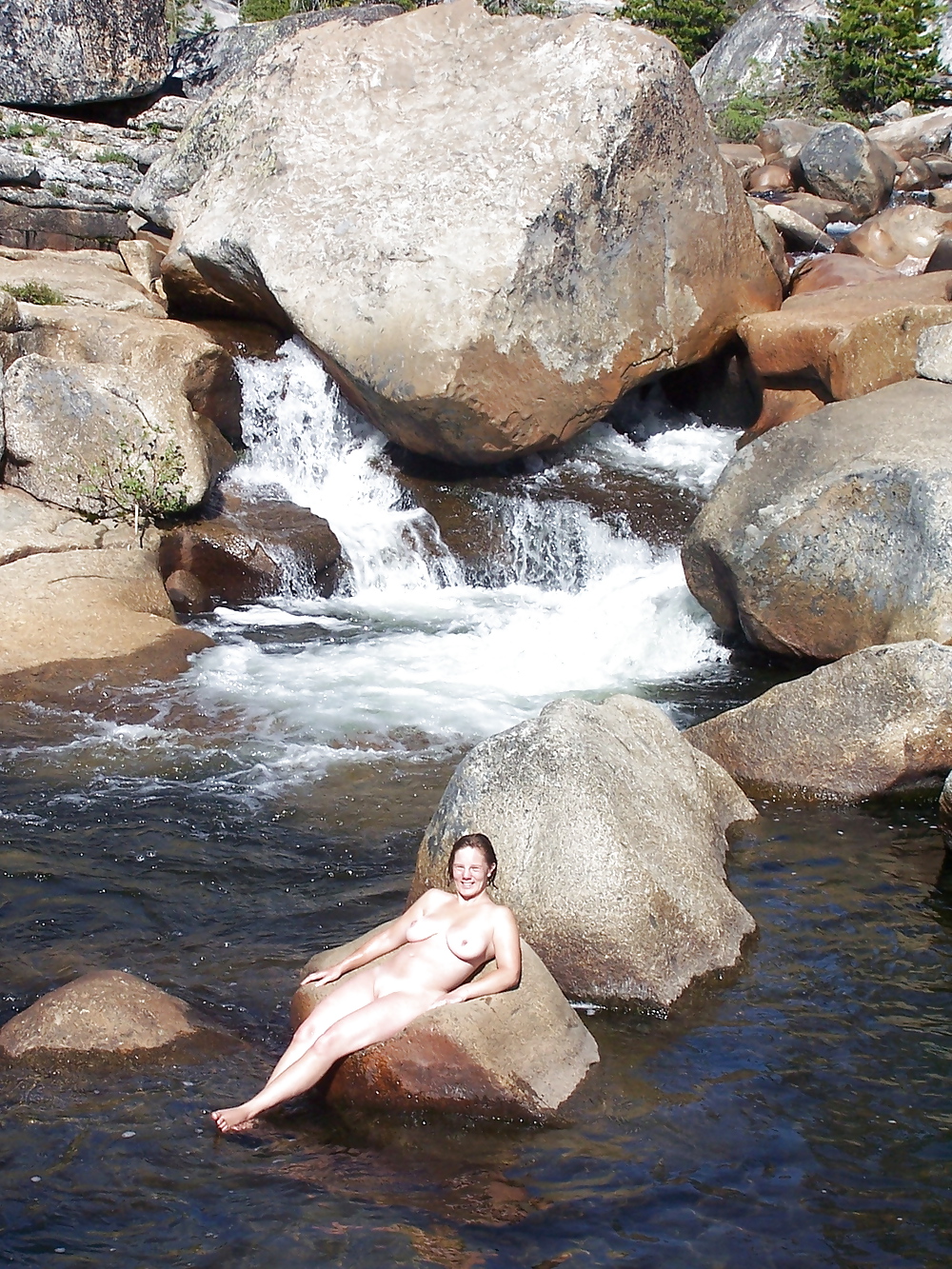 Nudist woman by the waterfall #14431426