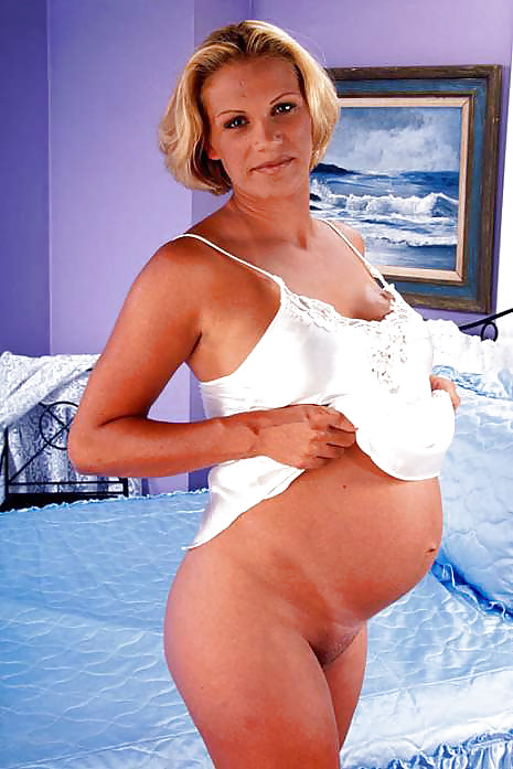 Pregnant blonde posing her sizable stomach #9537276