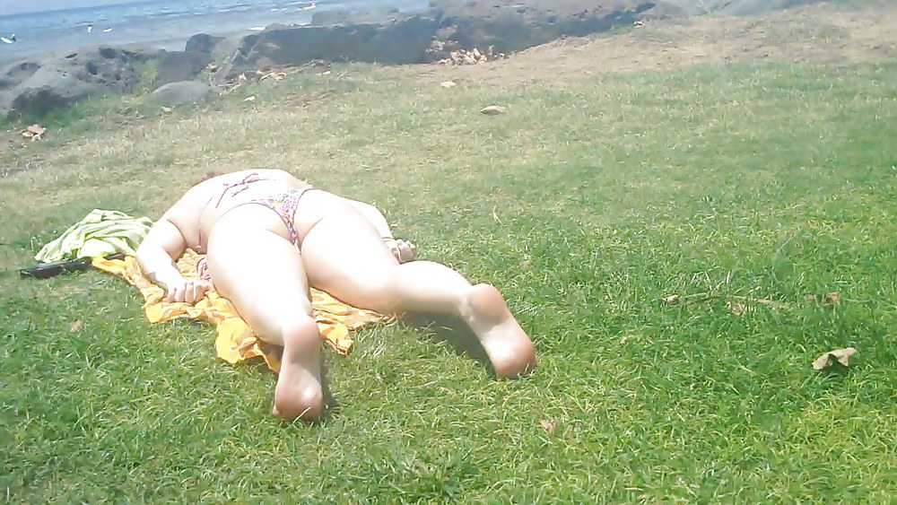 Laying with her ass & butt in a field of grass #4709133