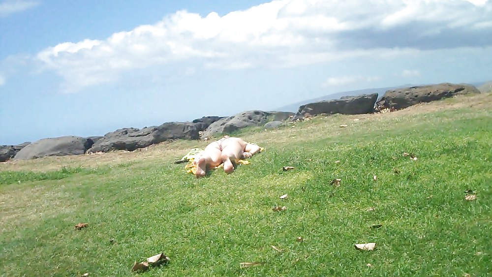 Laying with her ass & butt in a field of grass #4709143