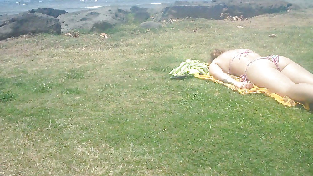 Laying with her ass & butt in a field of grass #4709181