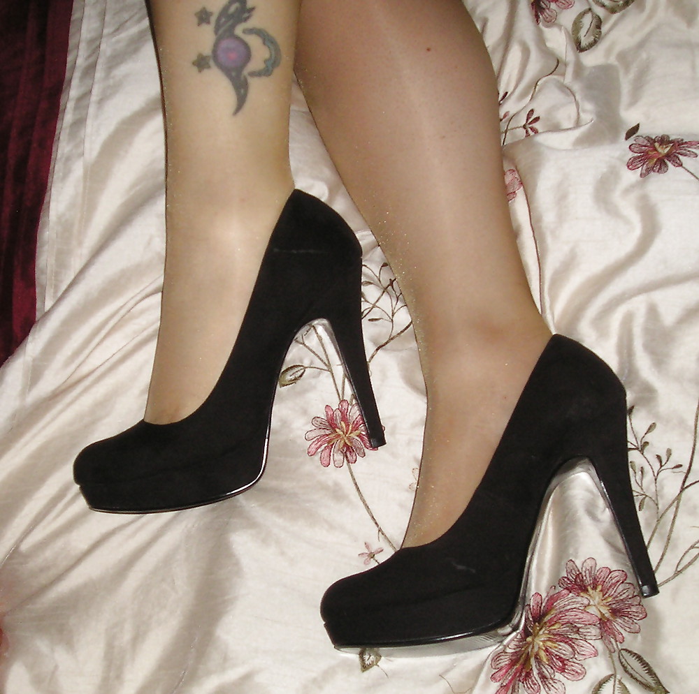 Tan tights and black heels #21224844