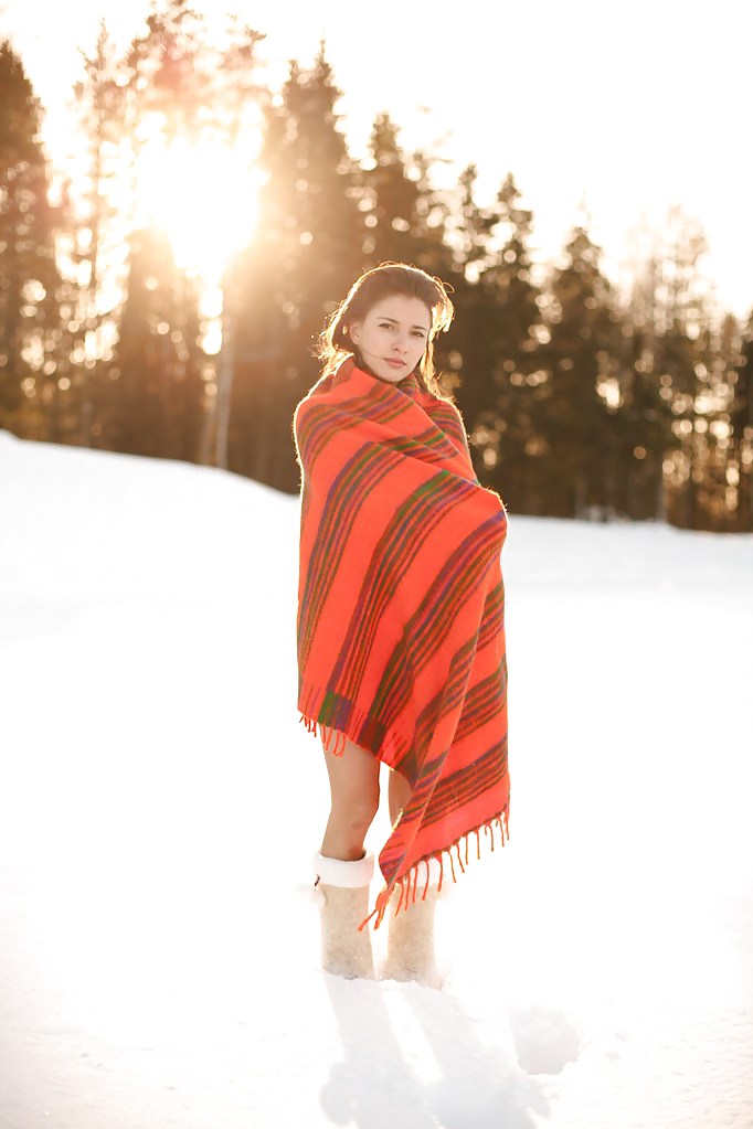 Cute brunette wearing only boots in the snow #12283359