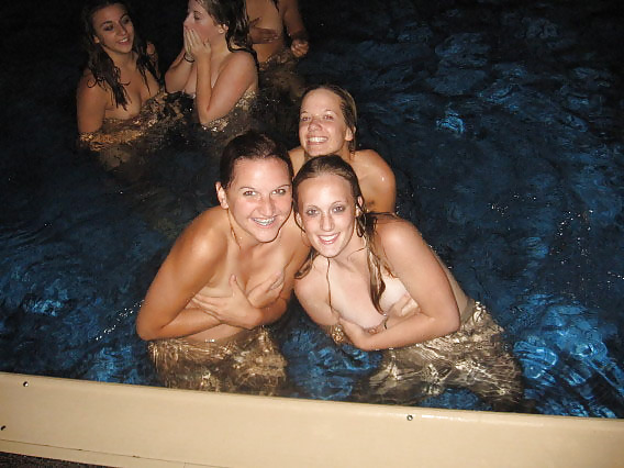 Naked girls playing in a pool by night #16312664