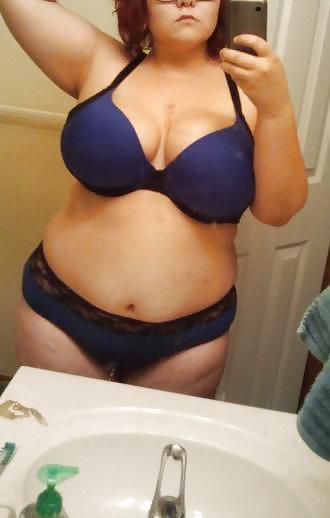 Chubby cutie shows off her tits