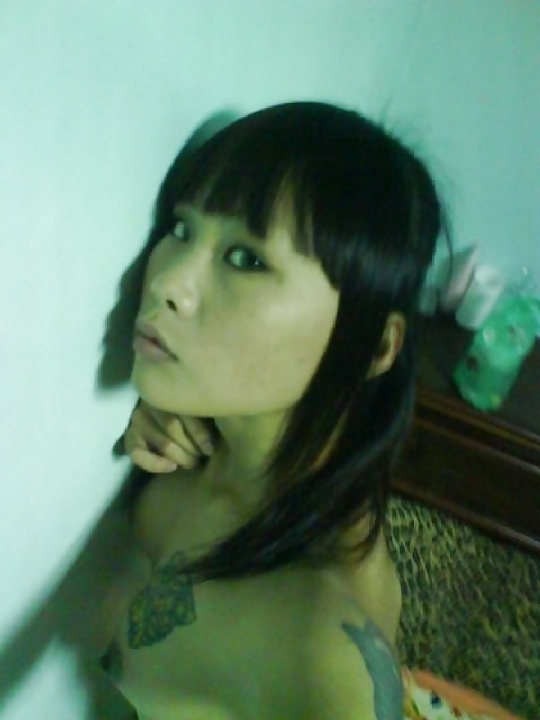 Tattooed asian girl takes pictures of her small breasts #4173292