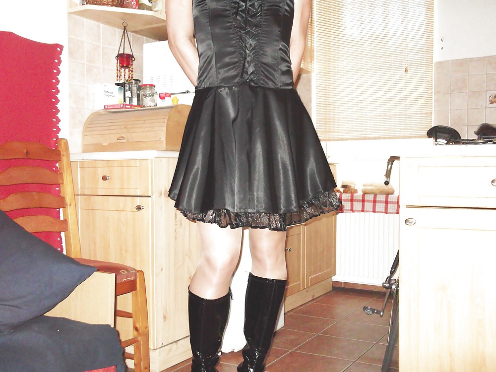Black satin dress and vinyl boots #21519723