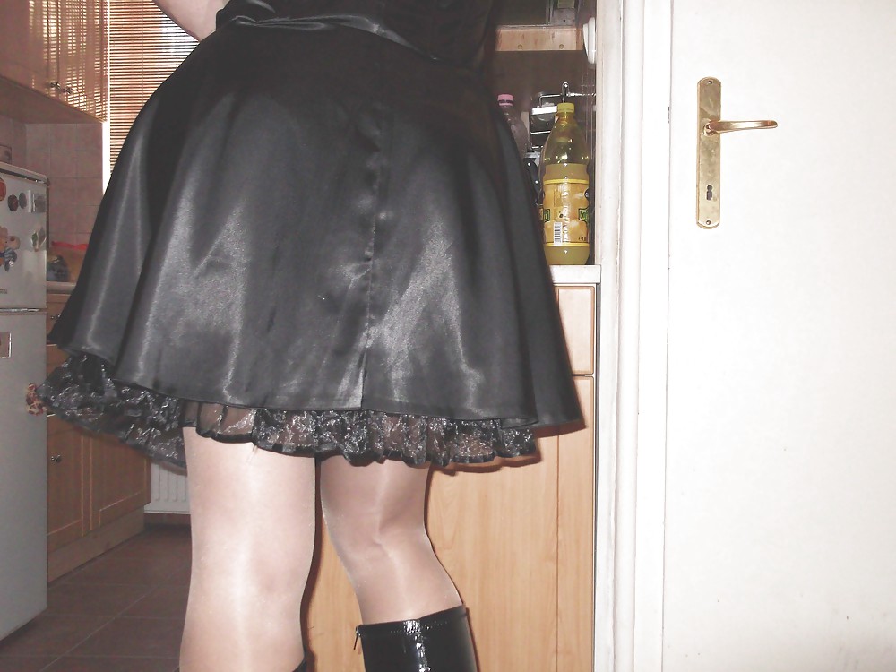Black satin dress and vinyl boots #21519730
