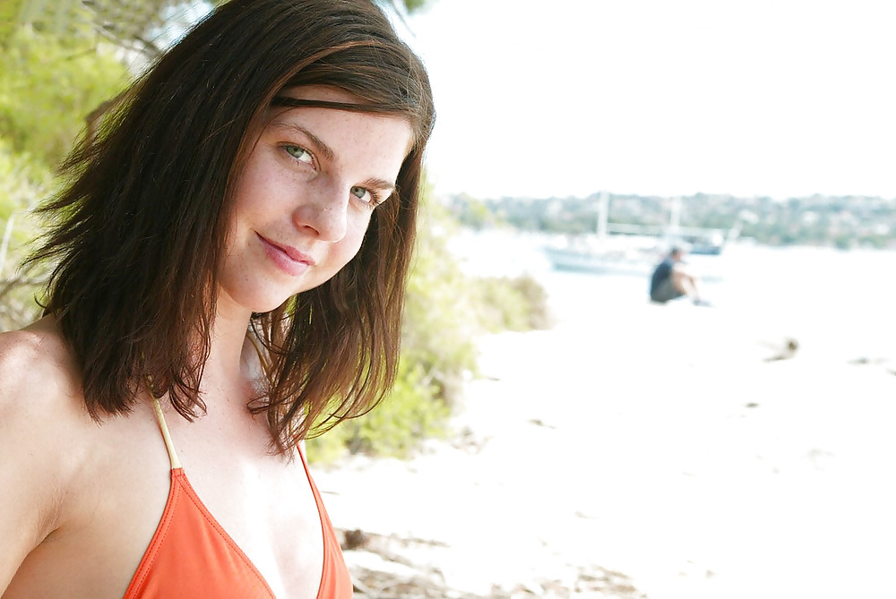 Brunette Bess showing off her body at the beach