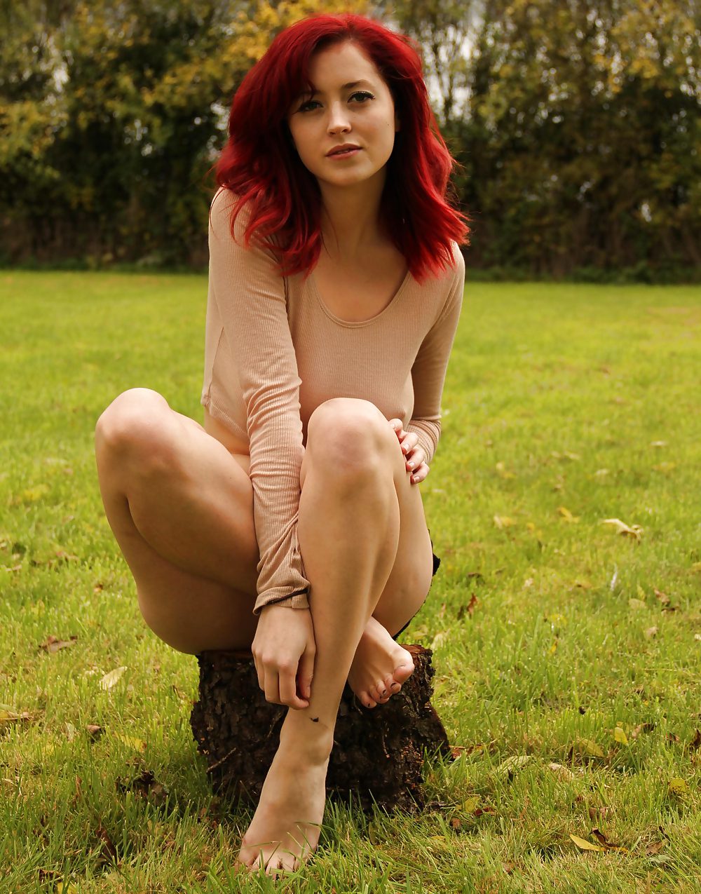 Beautiful curvy redhead posing outdoors #22021365