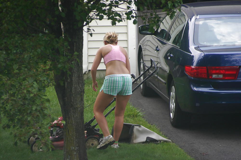 Neighbor mowing her lawn #5412507