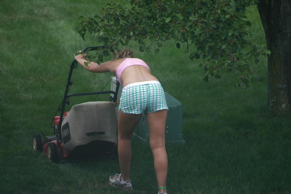 Neighbor mowing her lawn #5412512