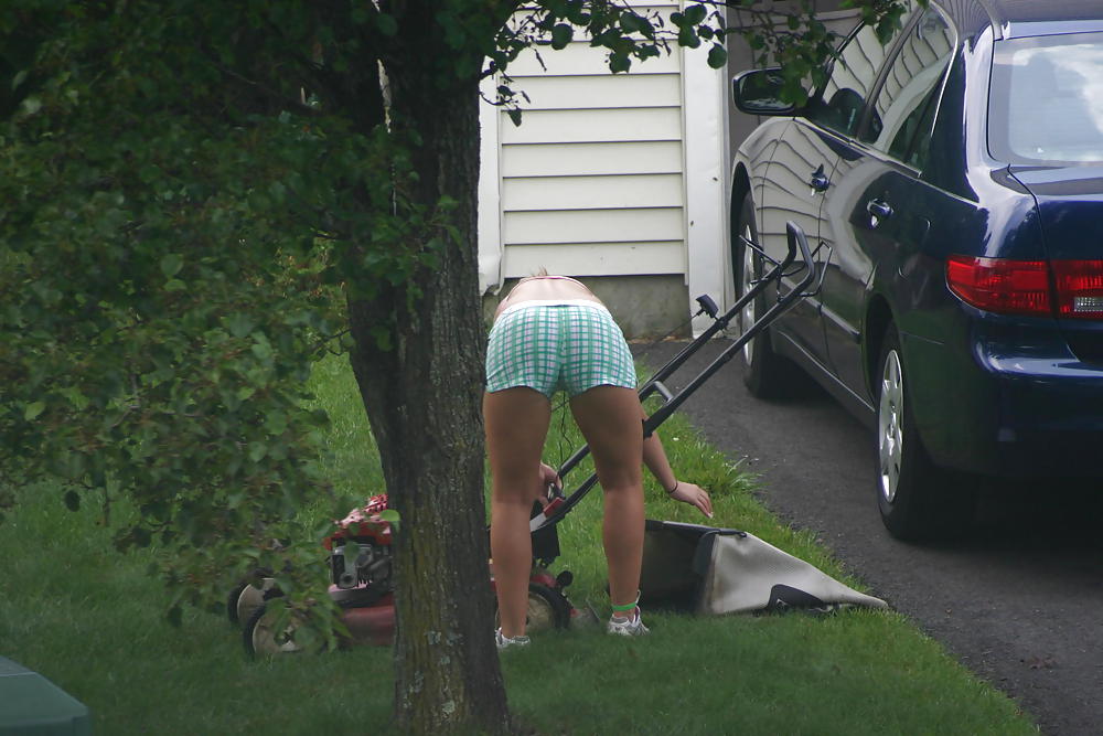 Neighbor mowing her lawn #5412523