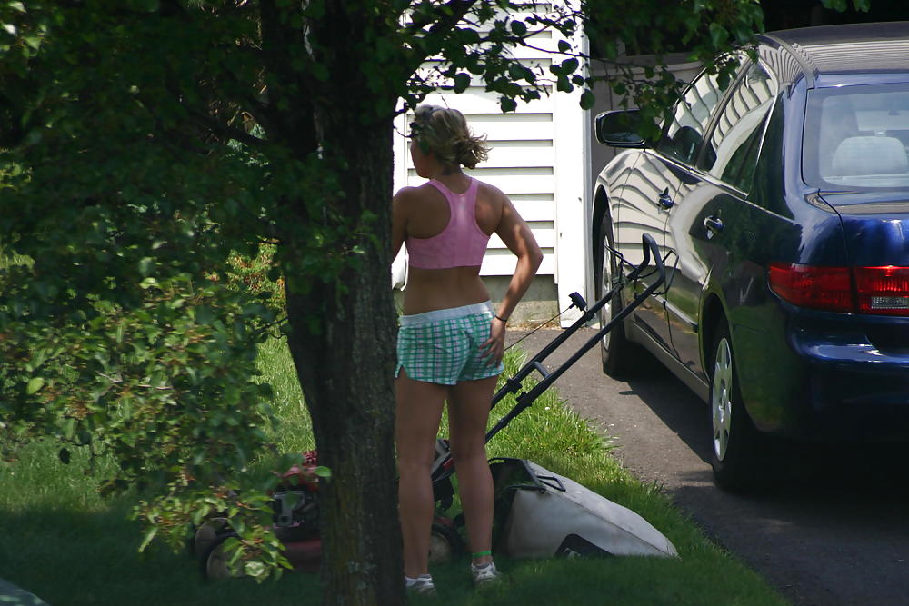 Neighbor mowing her lawn #5412527
