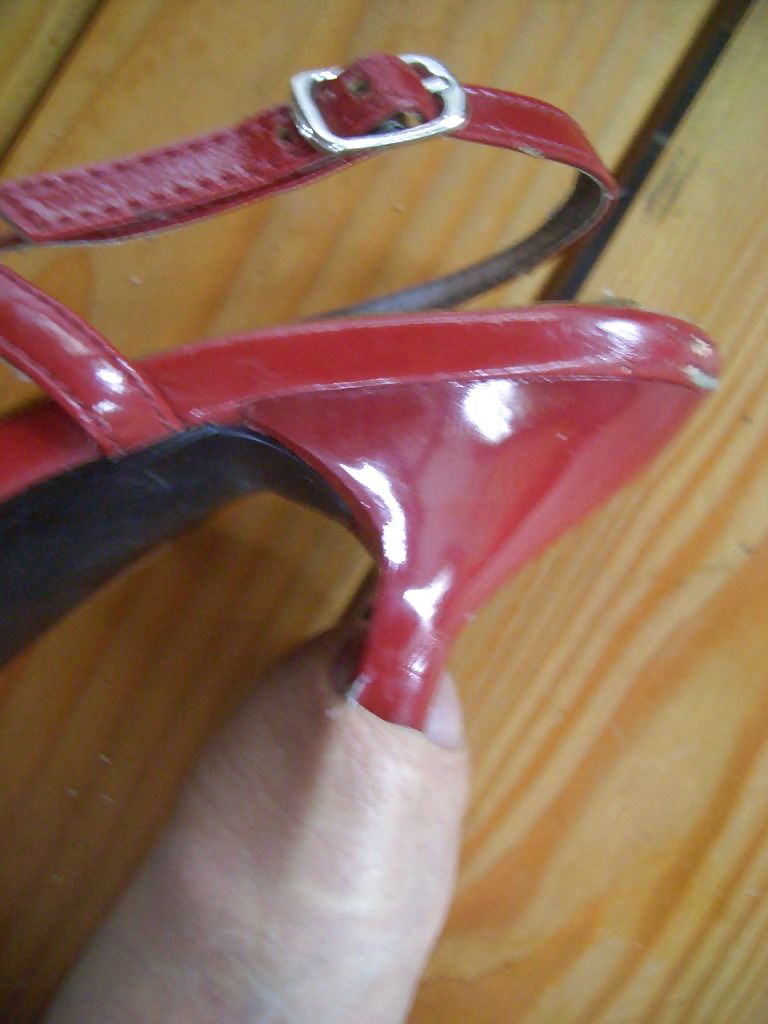 Red high-heeled sandales and cock