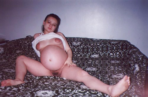 Little pregnant brunette on her bed #5504561
