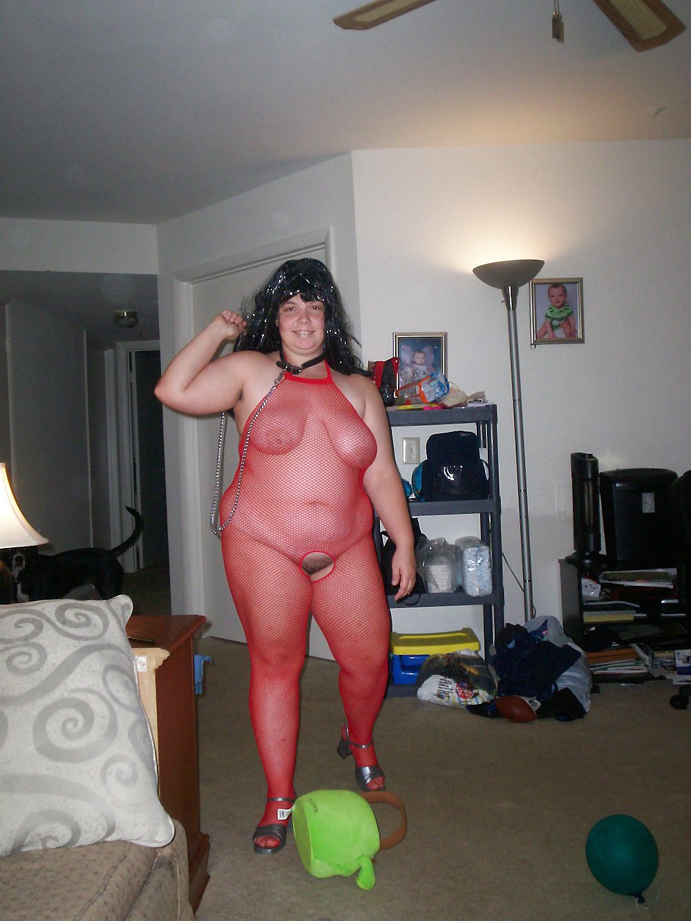 My wife in red body suit on a collar n leash