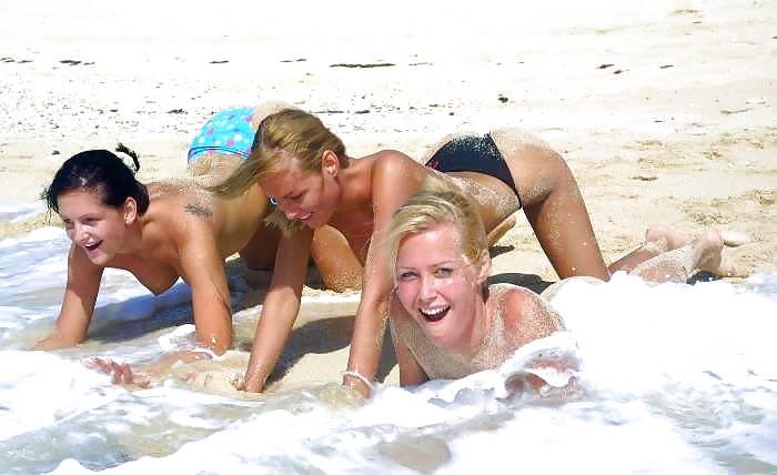 Three girls have fun on the beach - N. C.  #2449960