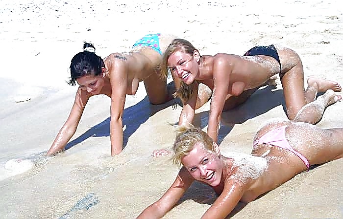 Three girls have fun on the beach - N. C.  #2449987