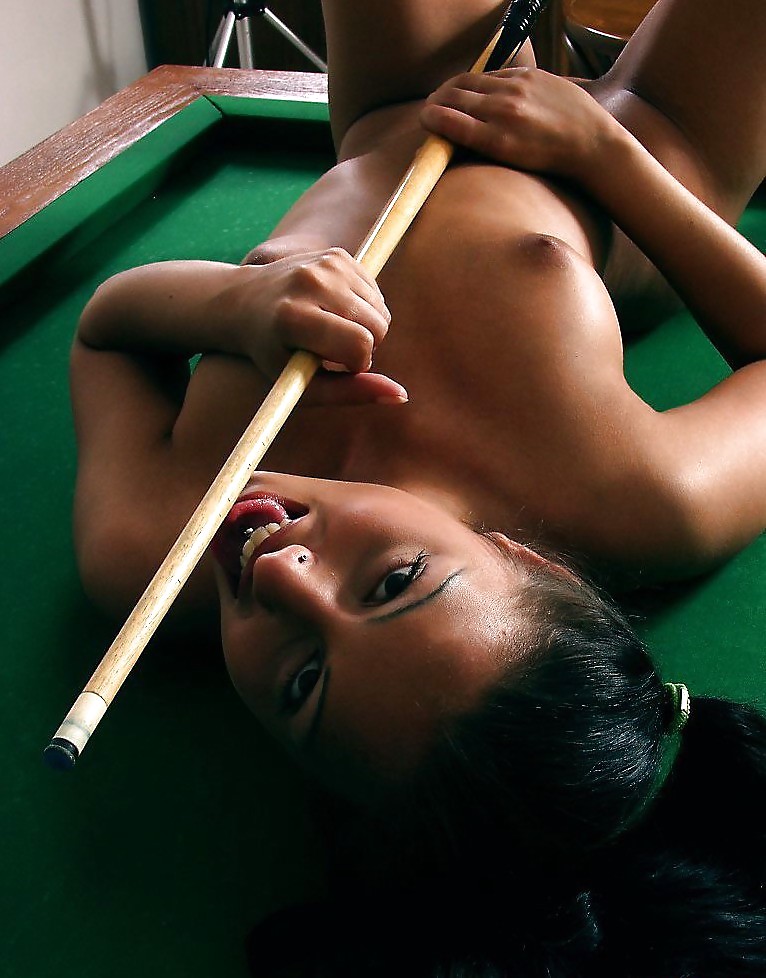 Brunette posing on a pool-table #19233885