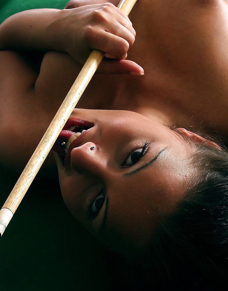 Brunette posing on a pool-table #19233890